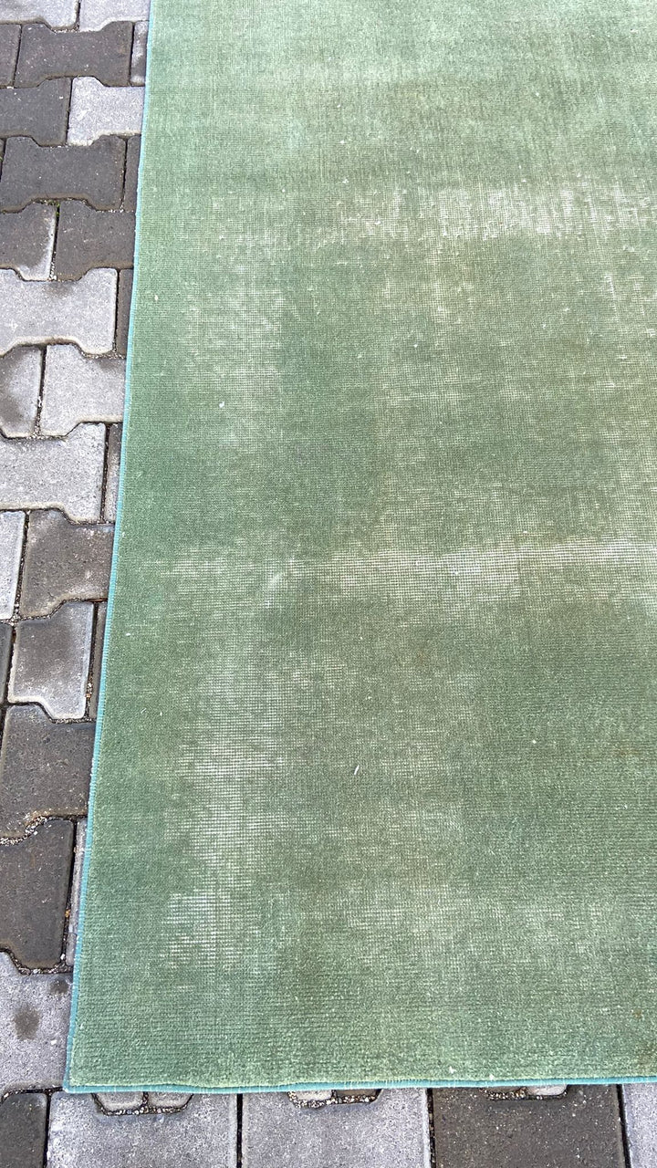 Green vintage handmade carpet