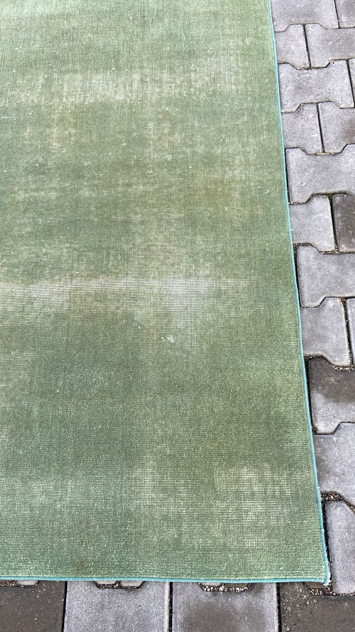 Green vintage handmade carpet