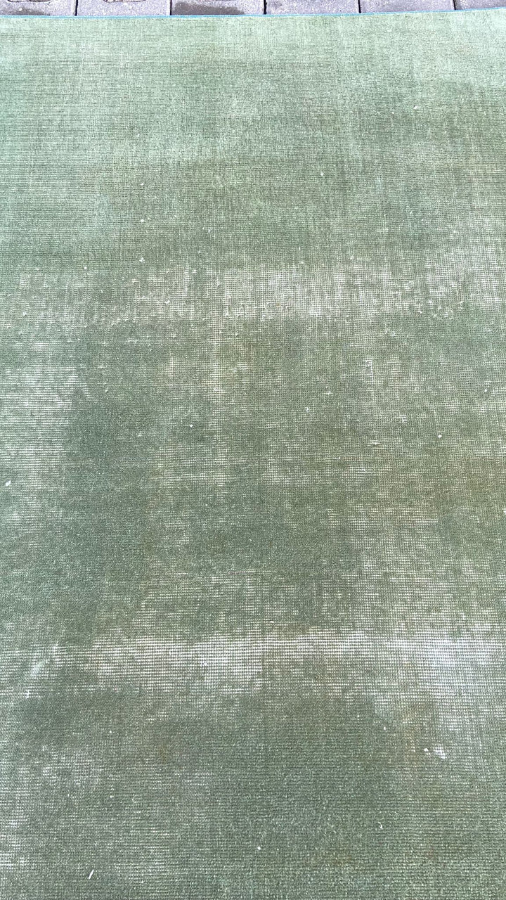 Green vintage handmade carpet