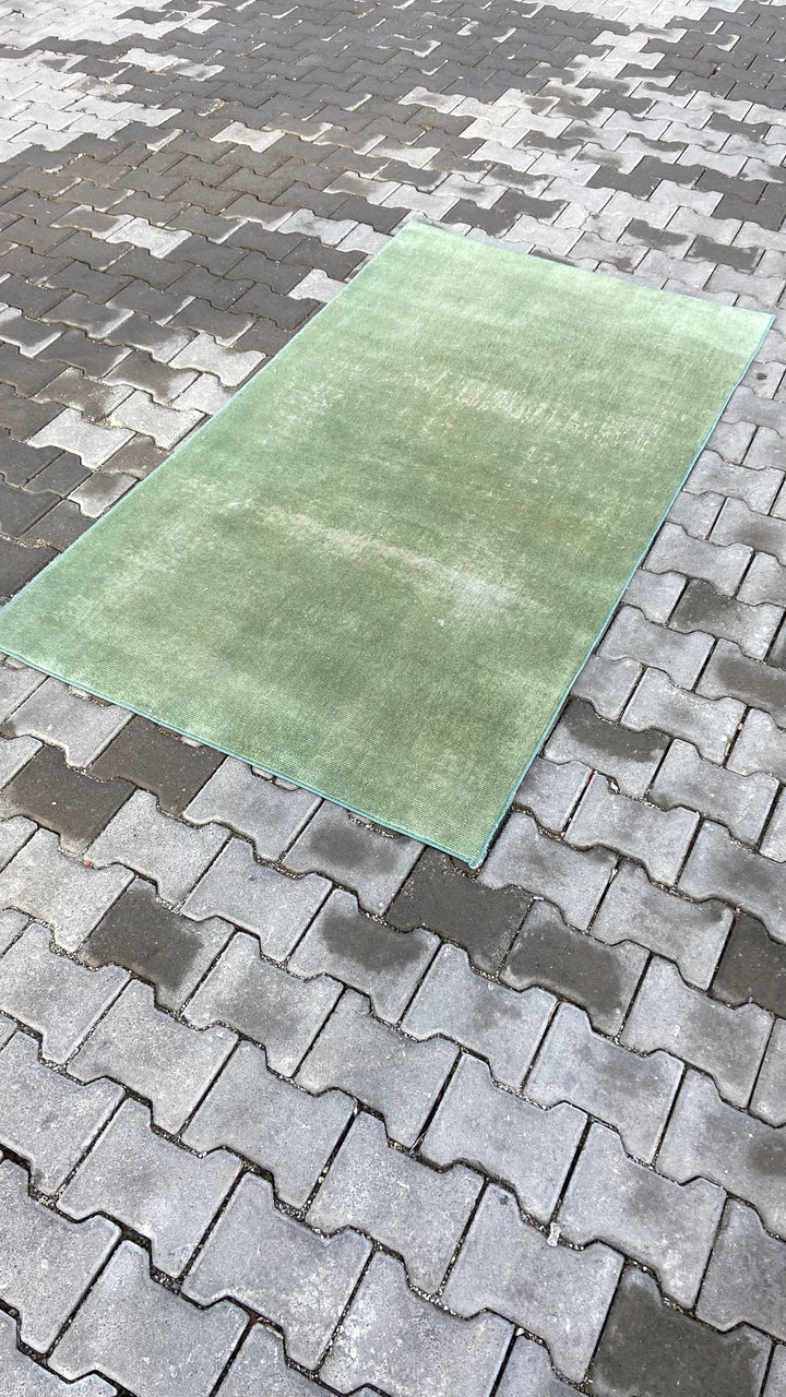 Green vintage handmade carpet