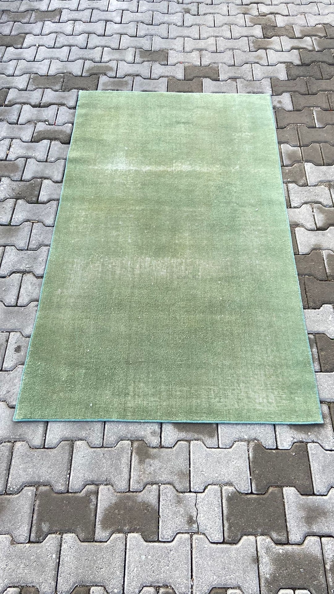 Green vintage handmade carpet
