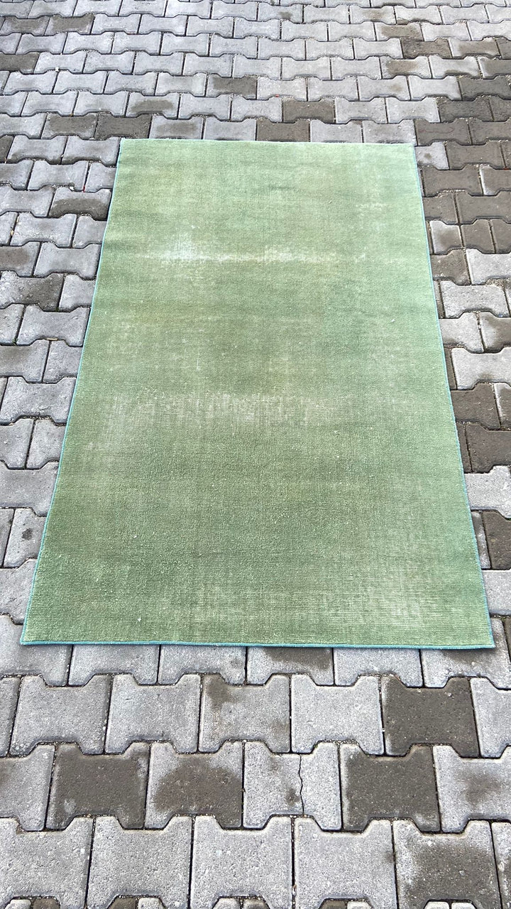 Green vintage handmade carpet