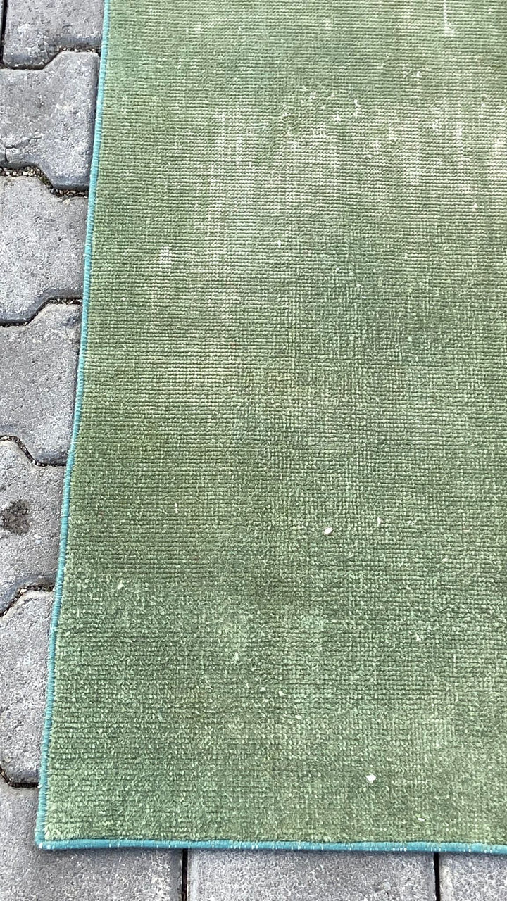 Green vintage handmade carpet