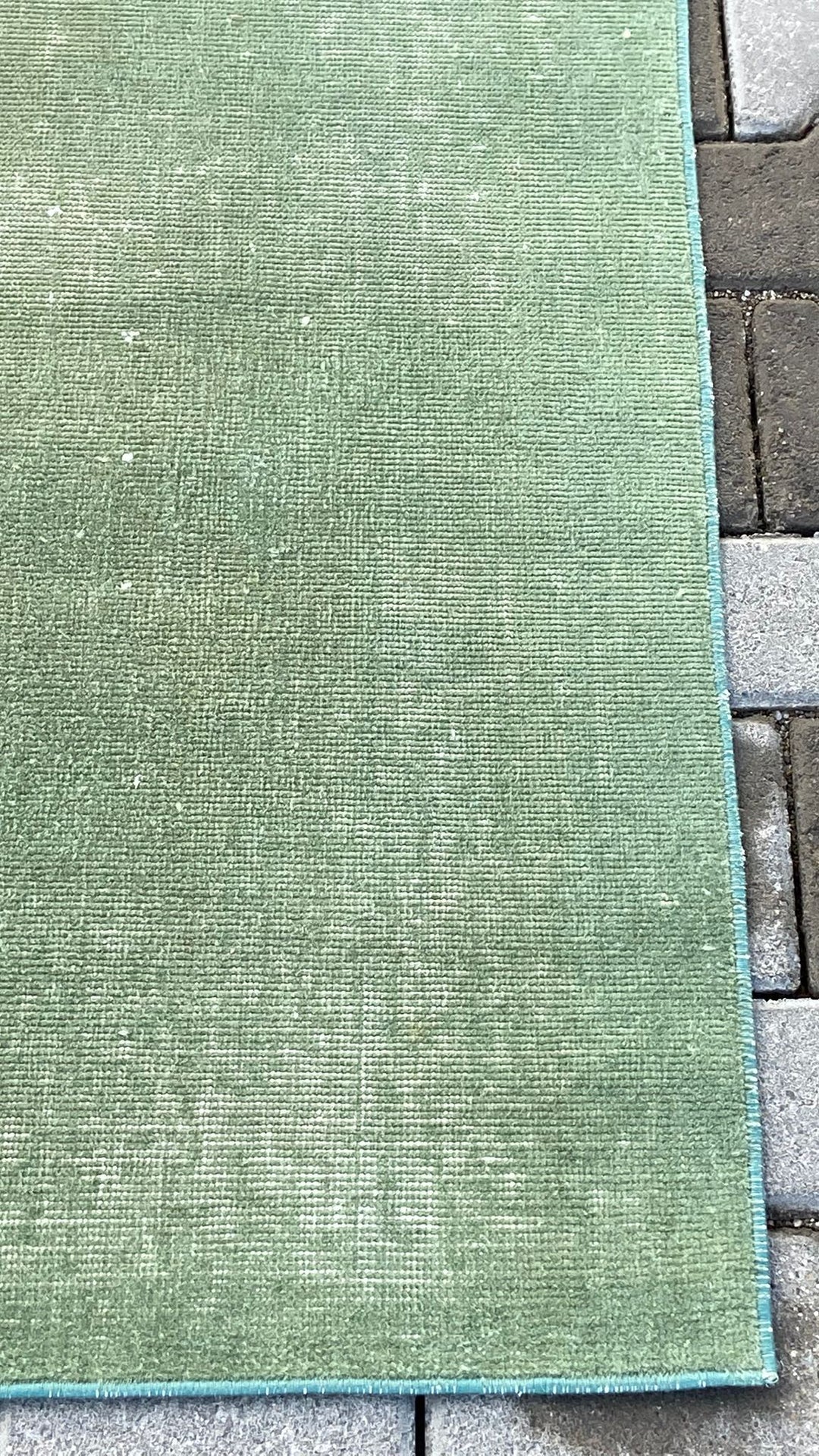Green vintage handmade carpet