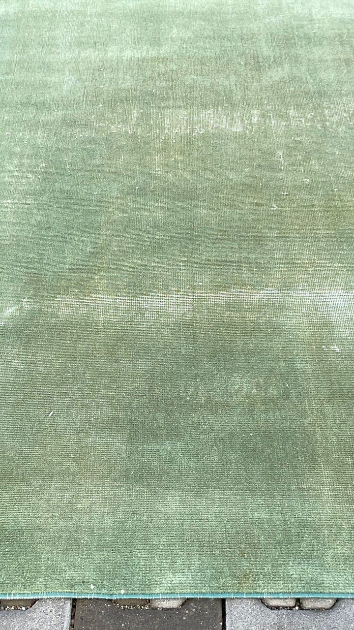 Green vintage handmade carpet
