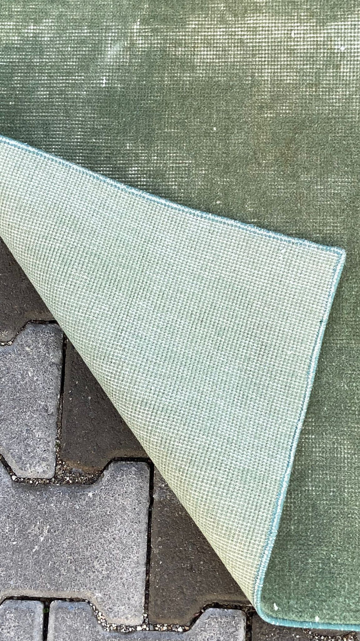 Green vintage handmade carpet
